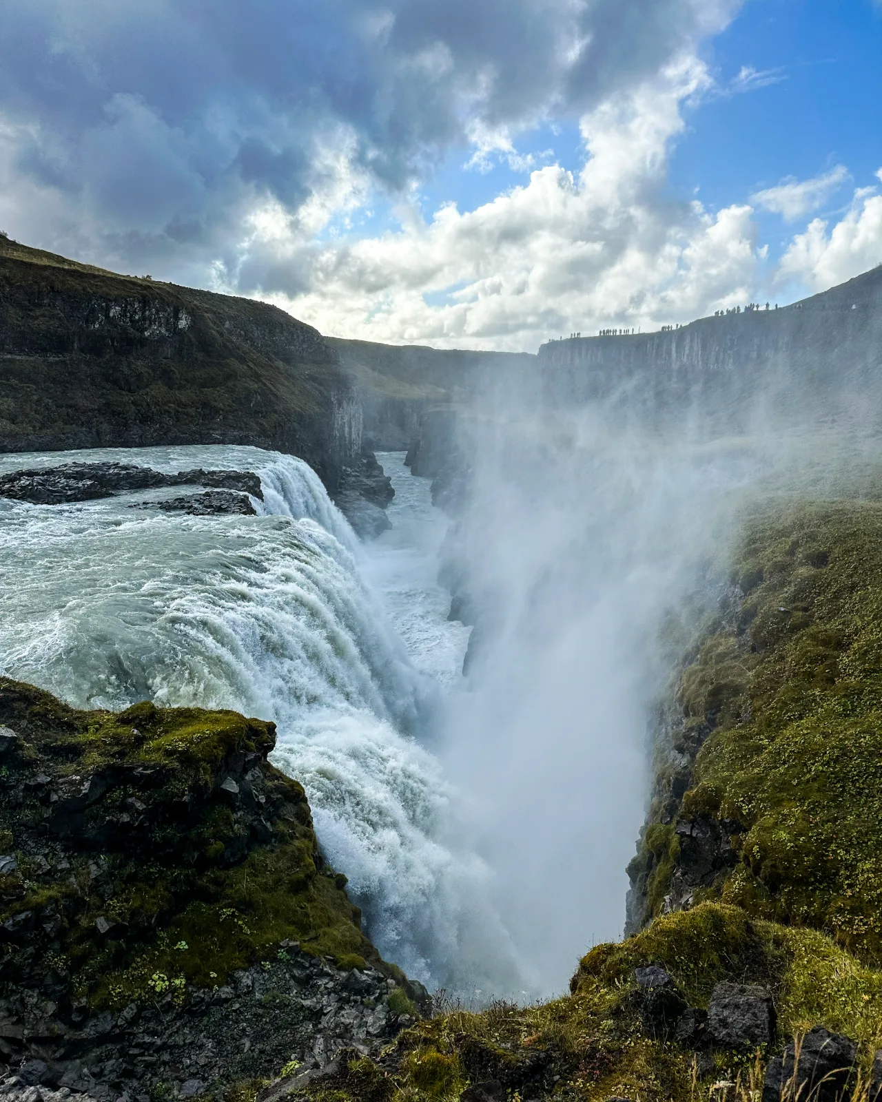 Waterfall thundering into a mossy canyon