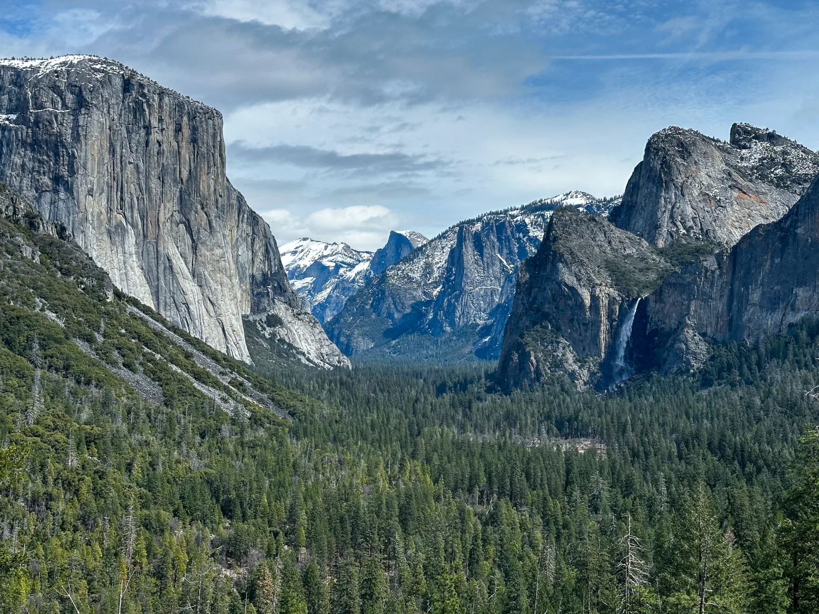 Granite cliffs and waterfall across Yosemite Valley